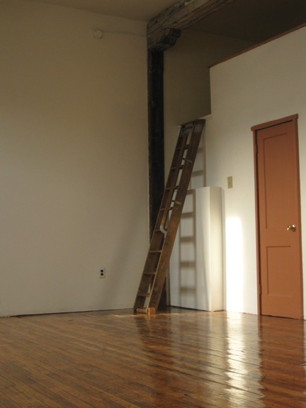 On the right&nbsp;is a laundry room with library ladder to the storage loft above it. 