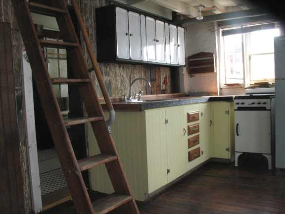 The butcher block counter, sink and stove in loft 3F