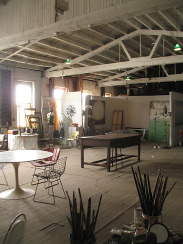 Studio 3R at the warehouse with paintings by Smokie Kittner in the background